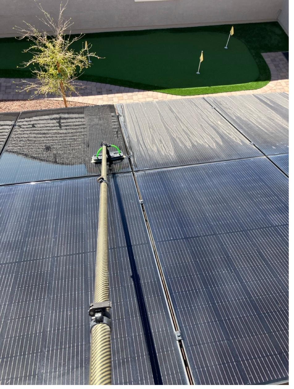 Solar panel cleaning on a residential roof