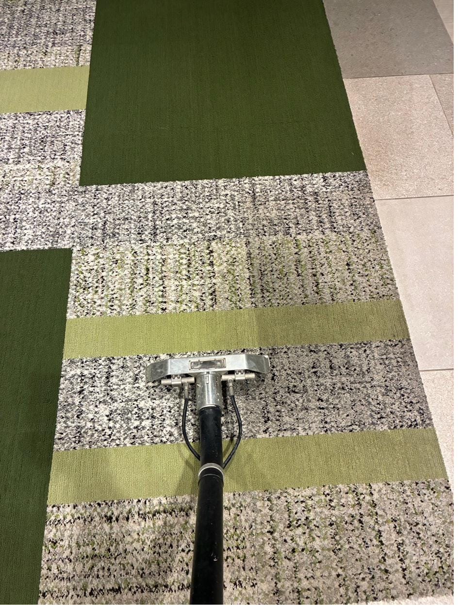 Tile floor cleaning in progress